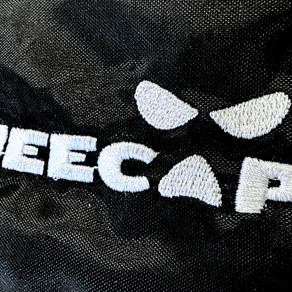 Kneecap bumbag in black with white logo embroidered